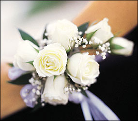 7 White Mini Roses Wristlet from Richardson's Flowers in Medford, NJ